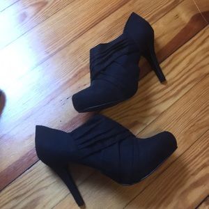 Black zip up heeled and platform booties